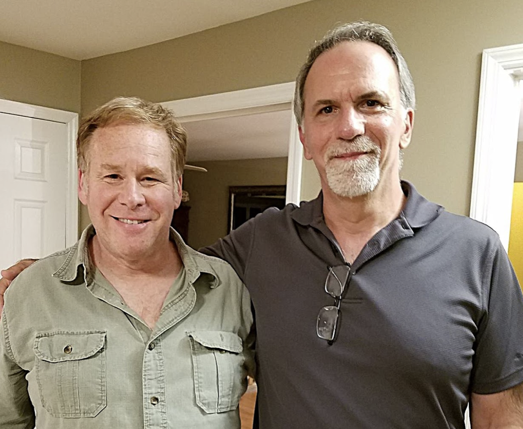 Westbury friends standing next to each other in a house.
